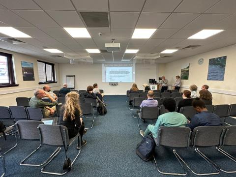 View of a seminar room from the back of the audience, with Brian Cullis and Alison Smith standing at the front 